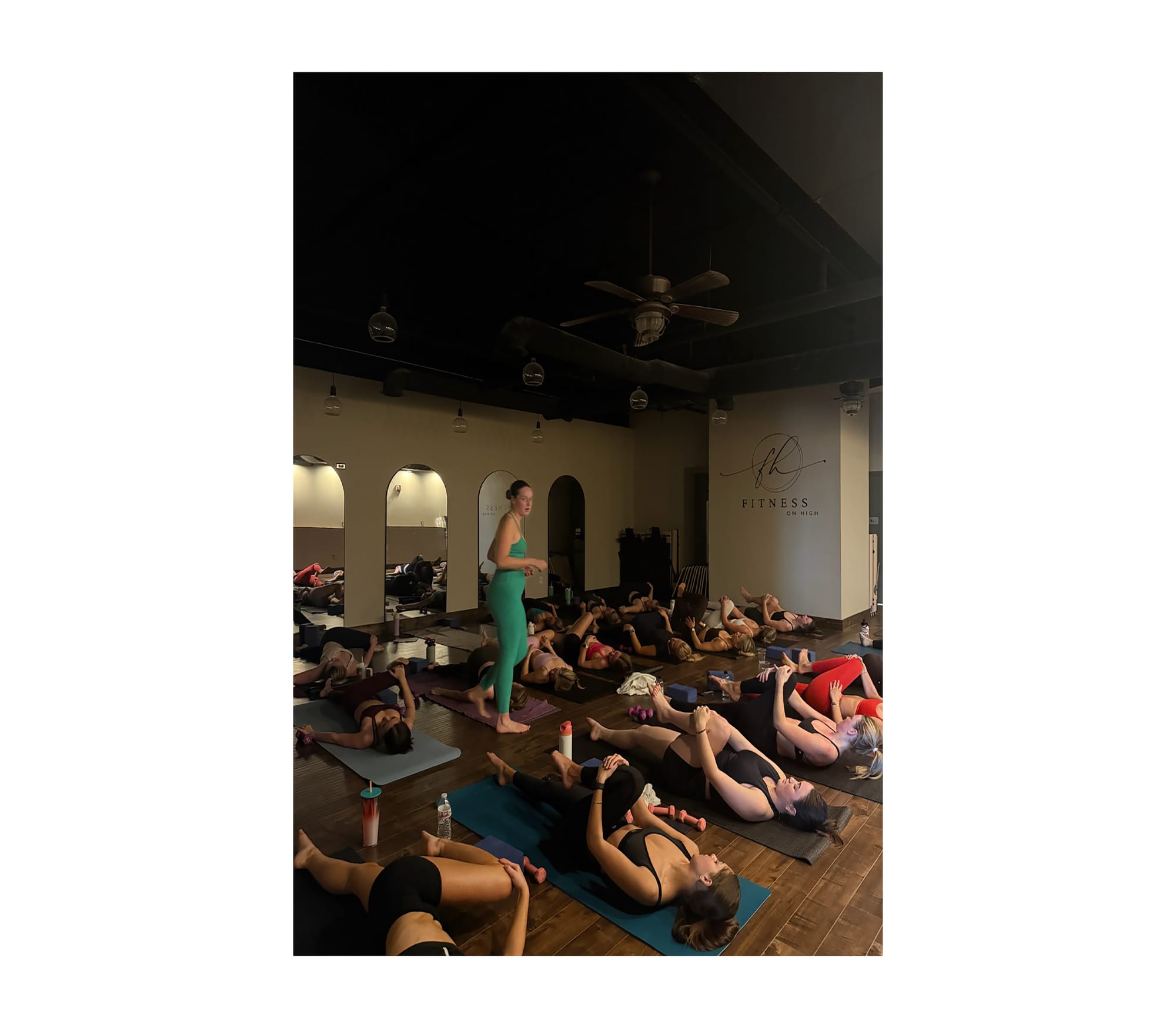 An instructor at Fitness on High leads attendees through class.