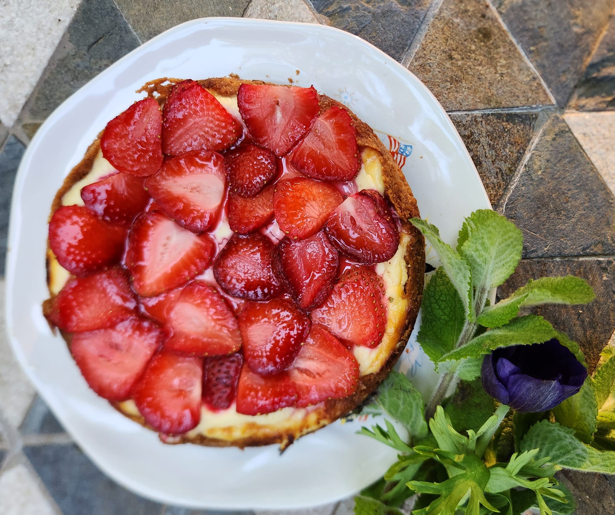 Zapekanka is a Ukrainian cake made with farmer cheese and fruit, this one topped with strawberries