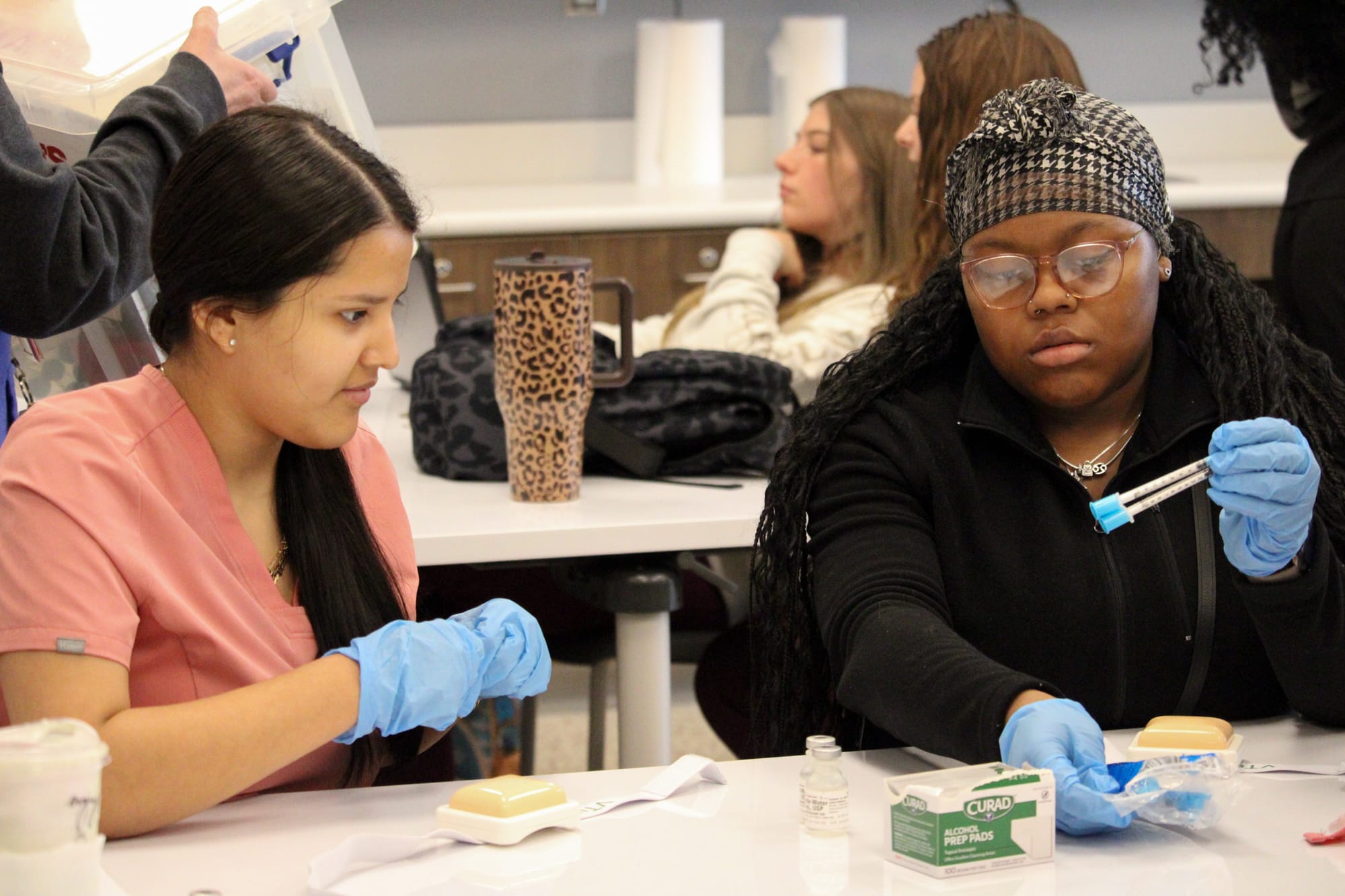 Two women use new medial supplies at the Butler Tech Bioscience Center