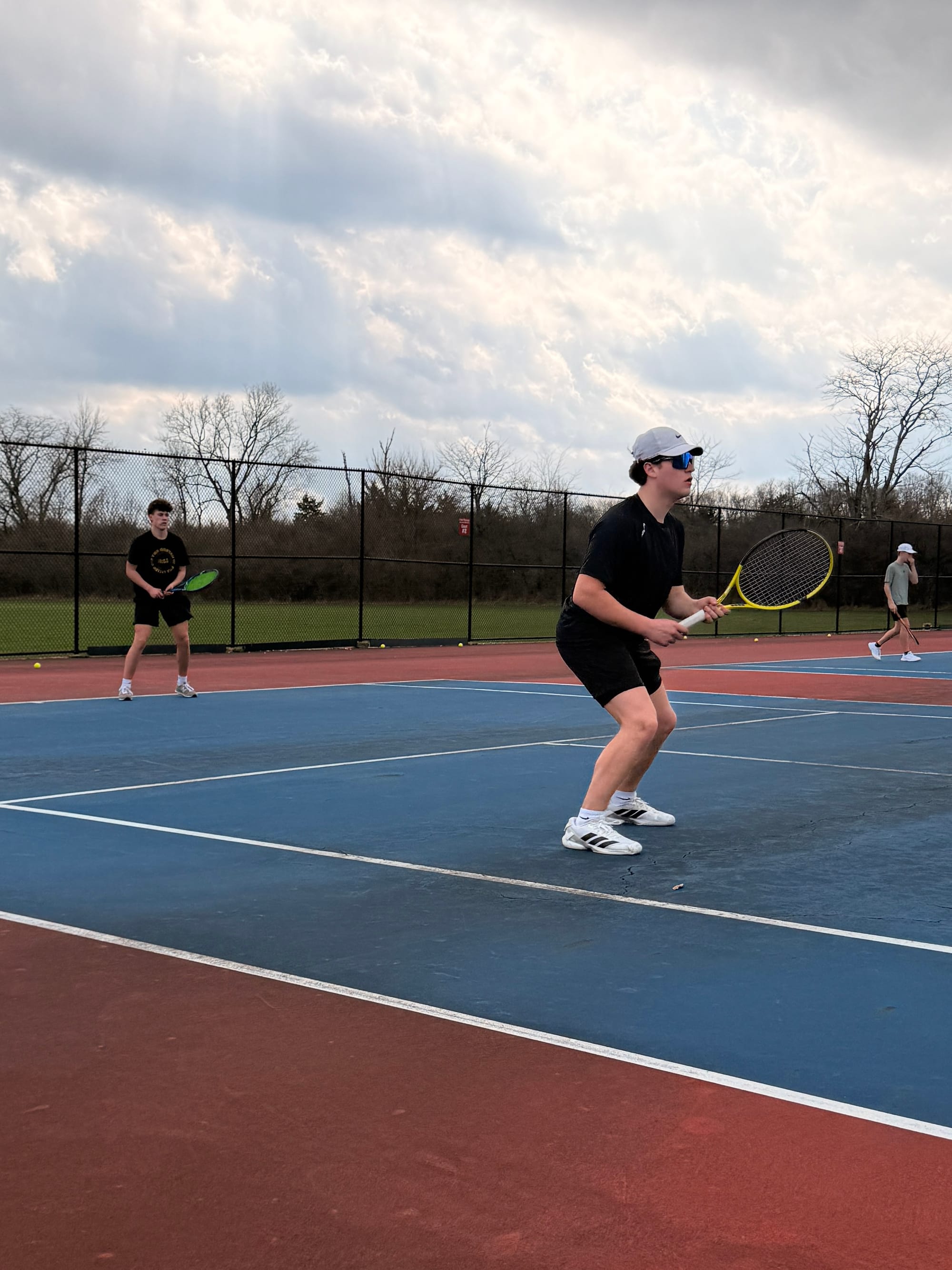 Page practicing at Talawanda High School’s courts with his doubles partner Jesse Reynolds.