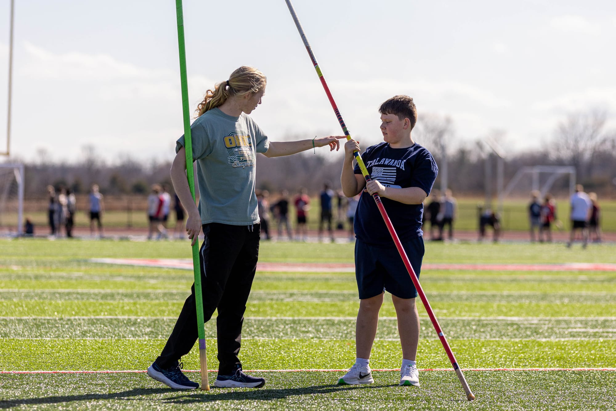 Nolan Hodgson helps coach a middle school athlete.