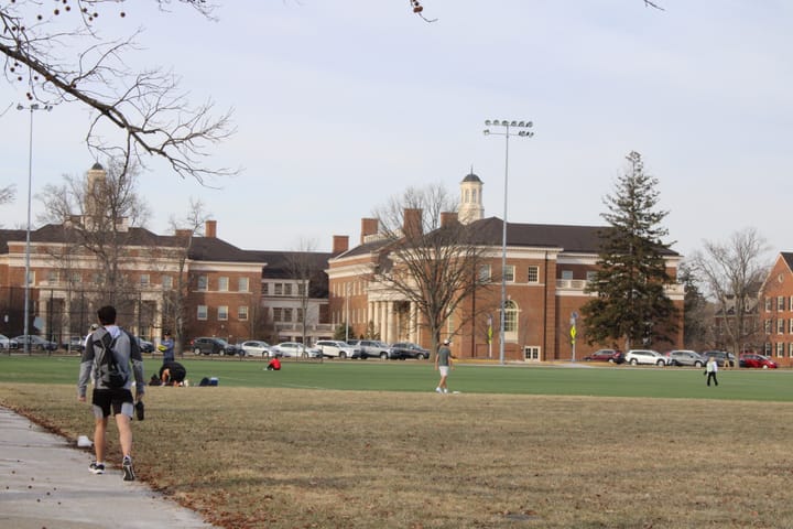 People walk on Cook Field at Miami University
