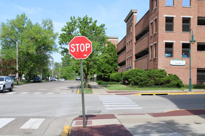 A stop sign at a Walnut Street intersection