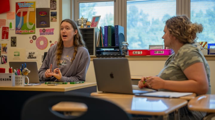 Math teachers Allyson Klovekorn (left) and Caroline Morrow (right) discuss the upcoming school year in a classroom at Talawanda High School.