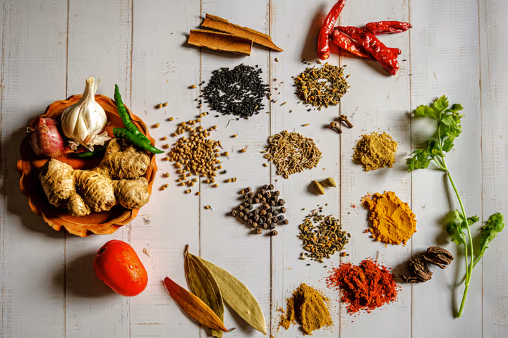 A variety of spices on a white table
