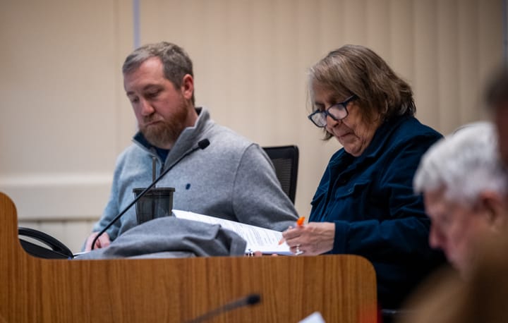 Oxford City Councilors Jason Bracken, left, and Roxanne Ornelas listen to a brief presentation of a resolution during an Oxford City Council meeting