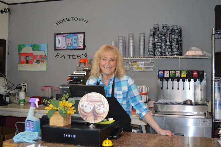 Angie Hunter, owner of Hometown Eatery, stands behind the counter